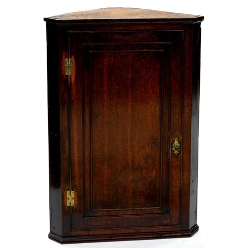 659 - A GEORGE III OAK CORNER CUPBOARD WITH PANELLED DOOR, 68CM L