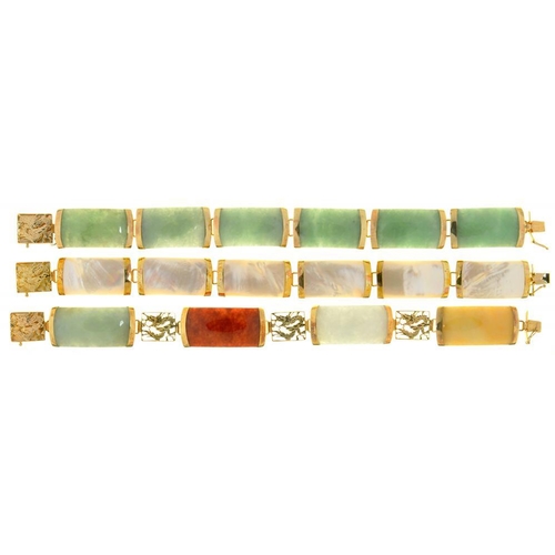 80 - TWO CHINESE JADE PANEL BRACELETS IN GOLD MARKED 14K AND A MOTHER OF PEARL PANEL BRACELET IN GOLD MAR... 