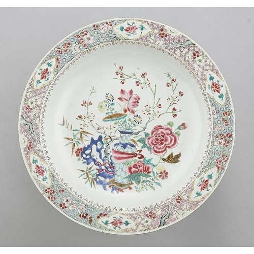 546 - A CHINESE  FAMILLE ROSE DISH, C 1770  enamelled with peony and other flowers, a blue hollow rock and... 