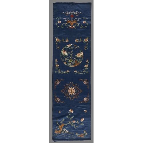 557 - A CHINESE EMBROIDERED SILK HANGING, EARLY 20TH C  with bats knots, peony and other flowers and folia... 