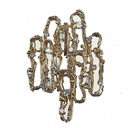 68 - ALAN MARTIN GARD.  A DIAMOND BROOCH-PENDANT in the form of a 'skein' of 18ct gold wirework set with ... 