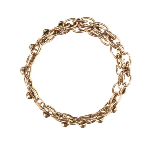 78 - AN EXPANDING GOLD BRACELET, C1910  of fancy links, approx diam 60mm, apparently unmarked, 17.5g... 