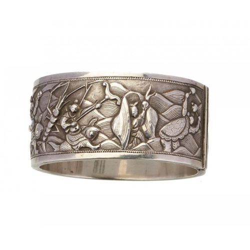 80 - A CHINESE EXPORT SILVER REPOUSSE BANGLE, C1900  decorated to either side with groups of figures, 57 ... 