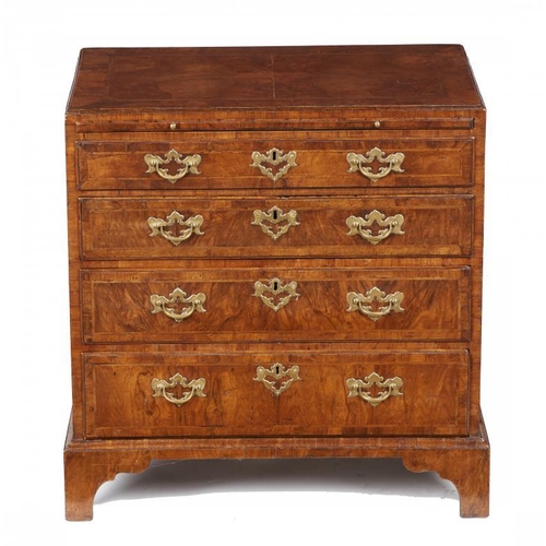 844 - A GEORGE II WALNUT AND FEATHERBANDED CHEST OF DRAWERS, C1730 the 'caddy' moulded top in matched vene... 