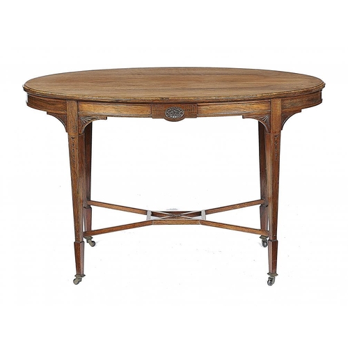 860 - A VICTORIAN OVAL ROSEWOOD CENTRE TABLE, C1890 the channelled frieze with carved paterae to the centr... 