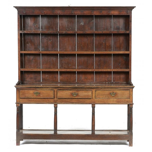 874 - A GEORGE III OAK DRESSER, EARLY 19TH C  the three shelf boarded rack on open base with three drawers... 