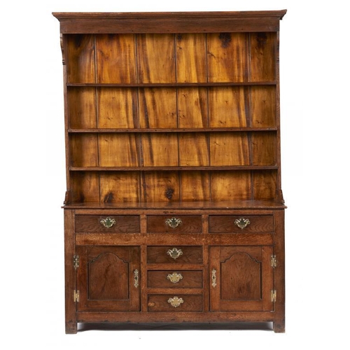 882 - AN OAK DRESSER, NORTH WALES, FIRST HALF 19TH C  with a boarded three shelf rack, fitted with drawers... 