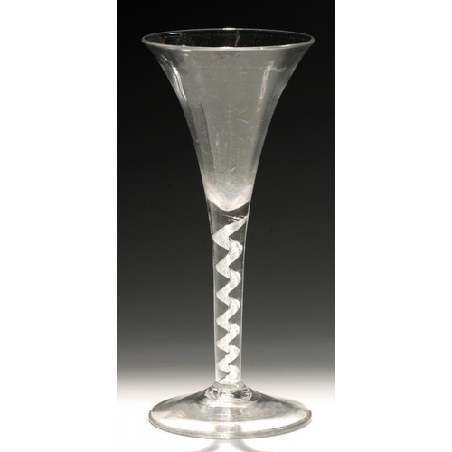 101 - AN ENGLISH WINE GLASS, C1750  the drawn trumpet  bowl on single series air twist stem with spiral ca... 