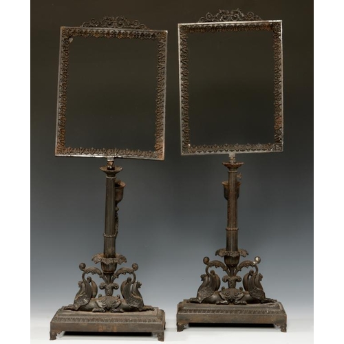 552 - A PAIR OF GERMAN CAST-IRON LITHOPHANE STANDS, C1850 the leafy rectangular frame on a pillar with sco... 