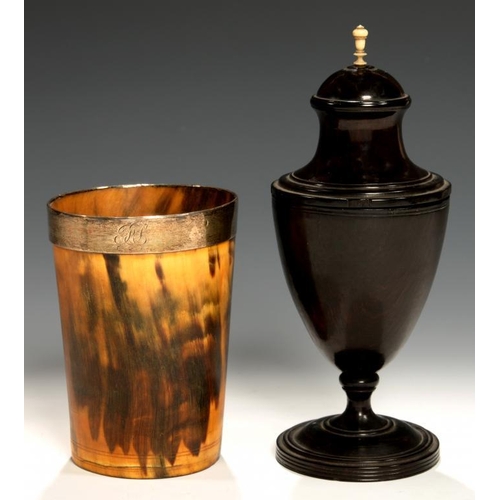 556 - A GEORGE III URN AND COVER OF, PROBABLY, LIGNUM VITAE, C1870   with bone finial, 19cm h and a silver... 