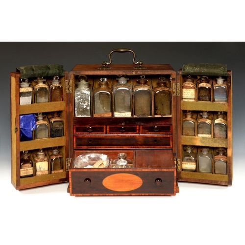 565 - A VICTORIAN MAHOGANY DOMESTIC MEDICINE CHEST, C1840 enclosed by two doors with fitted interior conta... 