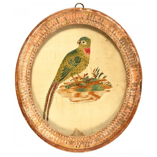 603 - TWO GEORGE III EMBROIDERED OVAL SILK PICTURES, C1780-1800  of a long tailed green bird and spray of ... 