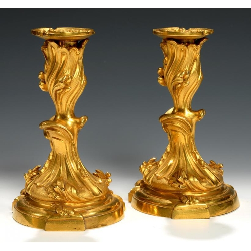 610 - A PAIR OF FRENCH ORMOLU  CANDLESTICKS IN THE MANNER OF JUSTE-AURELE MEISSONNIER, 19TH C nozzles, 17c... 