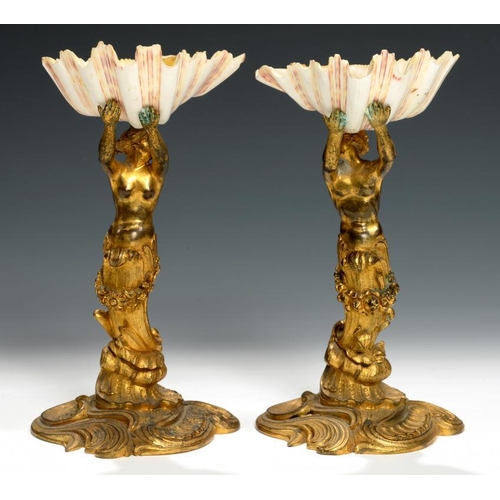 613 - A PAIR OF FRENCH ORMOLU NEREID FIGURAL STANDS, 19TH C  now supporting a seashell, 20cm h... 