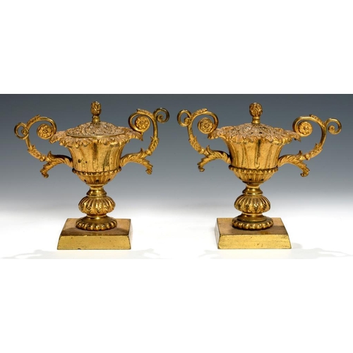 614 - A PAIR OF ENGLISH GILT BRASS PASTILLE BURNERS, EARLY 19TH C  of campana shape, the cover with flambe... 