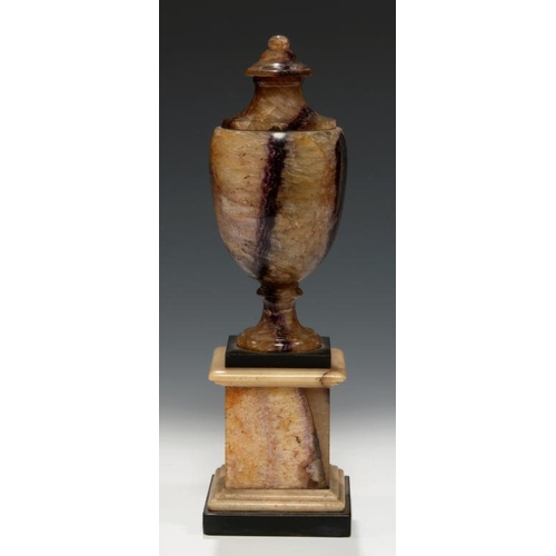 632 - A GEORGE III BLUE JOHN VASE, EARLY 19TH C  on Blue John, marble and Ashford Black marble pedestal, 2... 