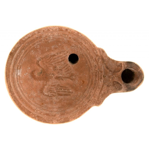 633 - ANTIQUITIES.  A ROMAN POTTERY OIL LAMP,  C SECOND CENTURY AD 9cm l