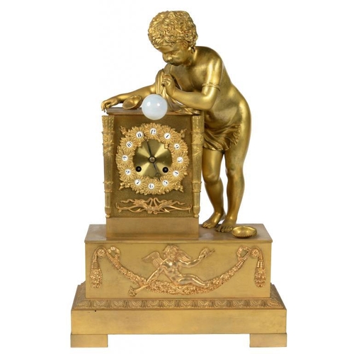 635 - A CHARLES X ORMOLU MANTEL CLOCK, C1830 the rectangular base surmounted by the figure of a boy with t... 