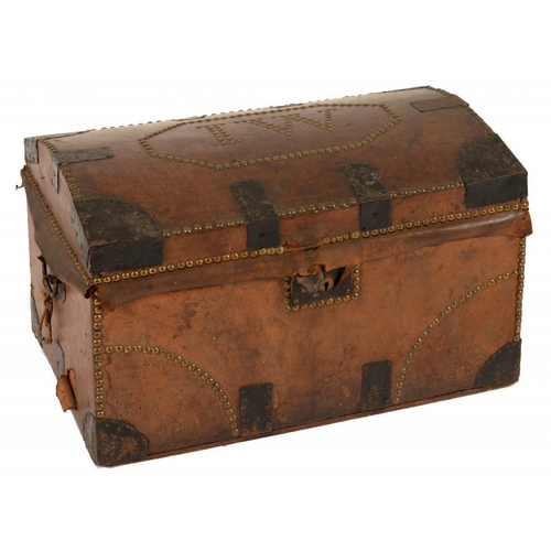 640 - A NORTHERN EUROPEAN  BRASS NAILED TAN LEATHER TRAVELLING TRUNK, EARLY 19TH C  the coffered lid with ... 