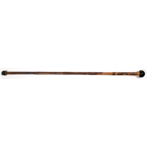 342 - A BAMBOO CANE WITH GLOBULAR GILTMETAL MOUNTED HARDSTONE POMMEL, 80CM L