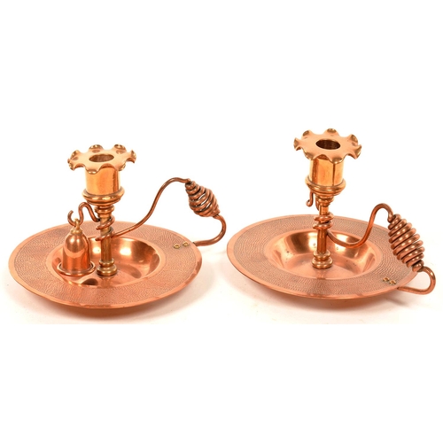 282 - A PAIR OF ARTS AND CRAFTS COPPER CHAMBER STICKS WITH SPIRAL ROD HANDLE, NOZZLES, PAN 15.5CM D, C1910