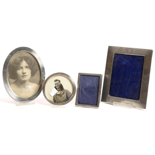 151 - FOUR SILVER PHOTOGRAPH FRAMES, EDWARD VII AND LATER, LARGEST 17.5 X 14 CM