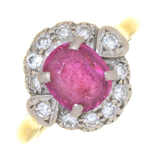 78 - A RUBY AND DIAMOND CLUSTER RING IN 18CT GOLD, THE OVAL RUBY APPROX 7 X 6 MM, TOWN AND DATE MARKS RUB... 