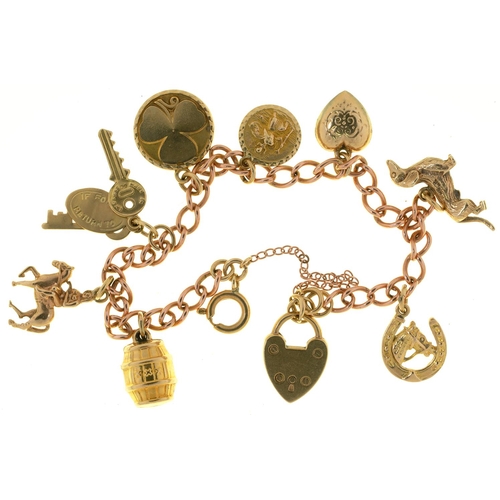 87 - A 9CT GOLD CHARM BRACELET, 18G