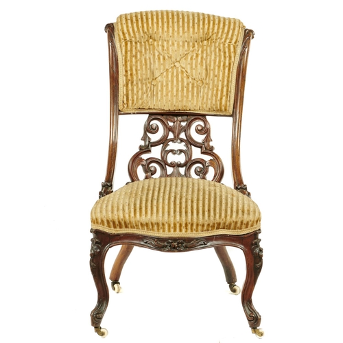 572 - A VICTORIAN ROSEWOOD NURSING CHAIR, C1870, WITH BUTTONED UPPER AND LOWER CARVED OPENWORK BACK, POTTE... 