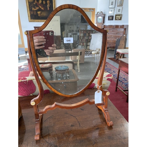 577 - A GEORGE III MAHOGANY SHIELD SHAPED DRESSING MIRROR, 38CM W