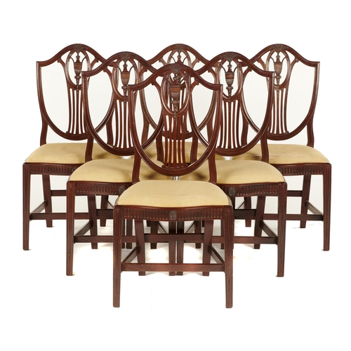 635 - A SET OF SIX GEORGE II MAHOGANY SHIELD BACK DINING CHAIRS, C1800, WITH CARVED OVAL URN MEDALLION SPL... 