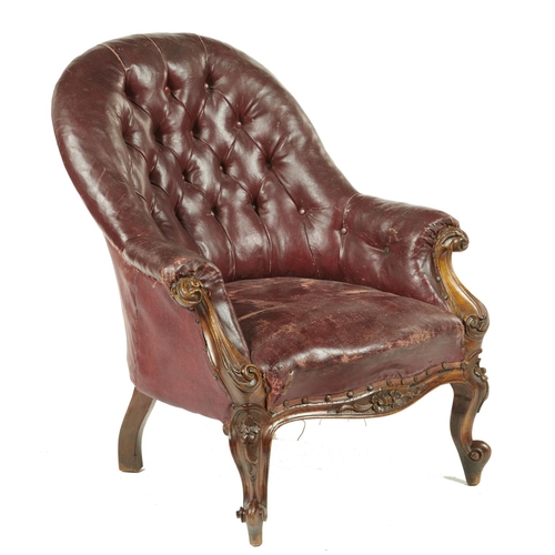 637 - A VICTORIAN CARVED WALNUT ARMCHAIR UPHOLSTERED IN EARLY BUTTONED MAROON LEATHERCLOTH, C1870, SEAT AP... 