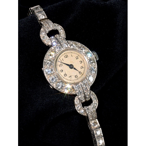 80 - A DIAMOND COCKTAIL WATCH ON DIAMOND BRACELET, C1940, IN PLATINUM, 3.9 X 2.3CM INCLUDING LUGS