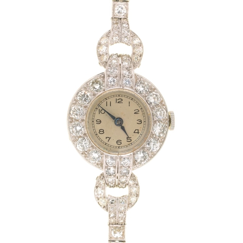 80 - A DIAMOND COCKTAIL WATCH ON DIAMOND BRACELET, C1940, IN PLATINUM, 3.9 X 2.3CM INCLUDING LUGS