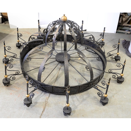 554 - A GOTHIC STYLE WROUGHT IRON TWELVE BRANCH CHANDELIER OF UNUSUAL SIZE, APPROXIMATELY 240CM D X 110CM ... 