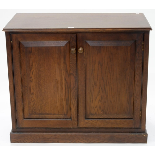 629 - AN OAK CUPBOARD WITH PANELLED DOORS, 81CM H; 95 X 50CM