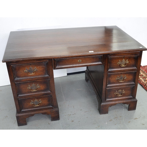 641 - A PANELLED OAK PEDESTAL DESK ON BRACKET FEET, C1930'S, 72CM H; 124 X 74CM