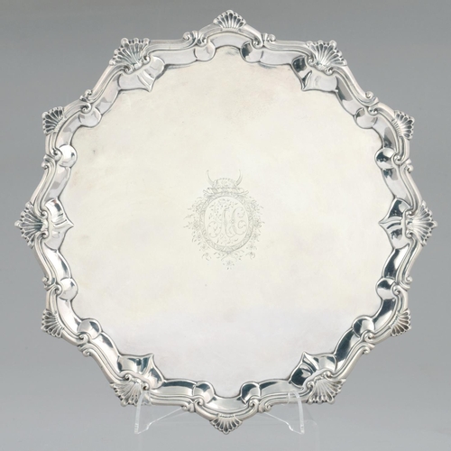 107 - A GEORGE III SILVER SALVER engraved with initials AC and crest in moulded border with shells at inte... 