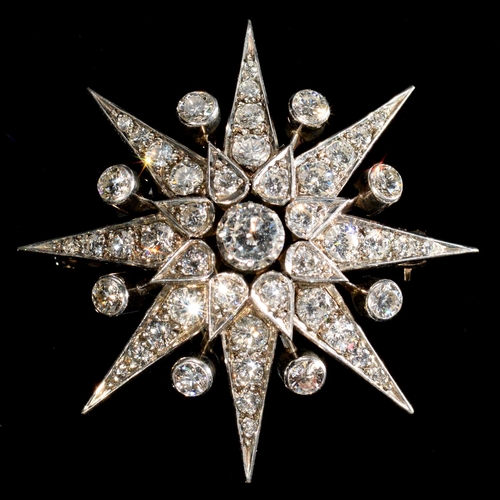 12 - A DIAMOND STAR BROOCH, 20TH C  in the form of an eight pointed star, mounted in gold, 41mm, 15g... 