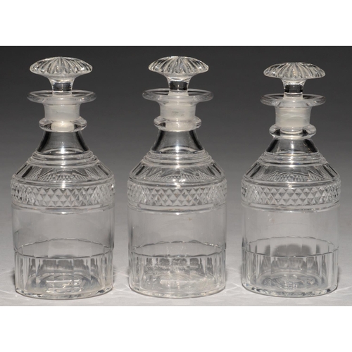 281 - A SET OF THREE ENGLISH CUT GLASS CYLINDRICAL DECANTERS AND STOPPERS, 19TH C   20cm h... 