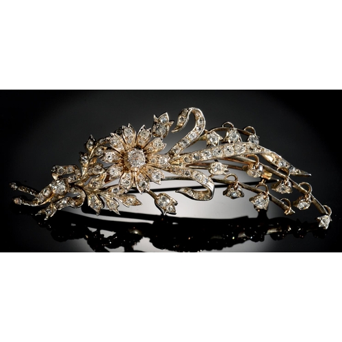 31 - A BELLE EPOQUE DIAMOND SPRAY BROOCH, C1900  the flowerheads en tremblant, mounted in silver and gold... 