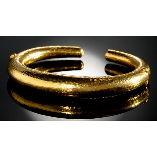 34 - ILIAS LALAOUNIS. A GREEK GOLD BANGLE with two invisible hinges, 74mm, maker's and control mark, 750 ... 