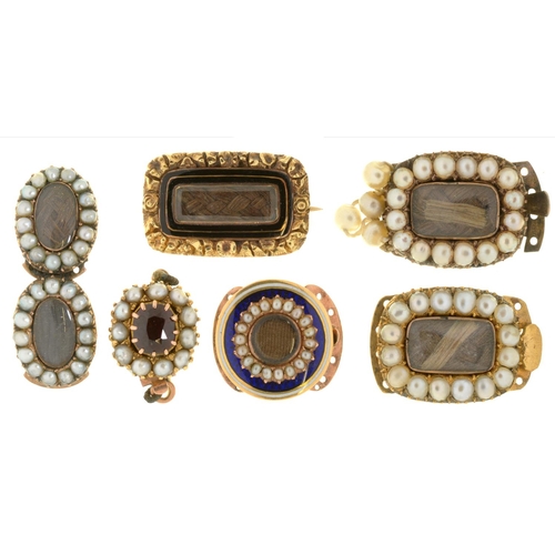 45 - A GROUP OF GOLD MOURNING BROOCHES AND SLIDES  all but one set with split pearls, two enamelled, one ... 