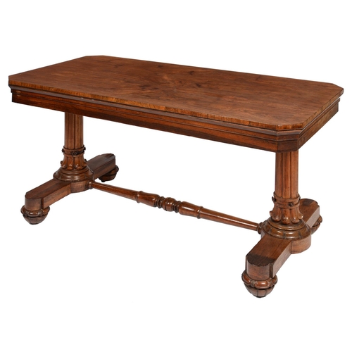 616 - A WILLIAM IV ROSEWOOD LIBRARY TABLE, C1835 the cut cornered top on turned end supports with lotus ca... 