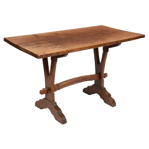 634 - AN OAK TABLE BY JACK GRIMBLE OF CROMER, NORFOLK,  MID 20TH C  with one-piece top on forked trestles ... 