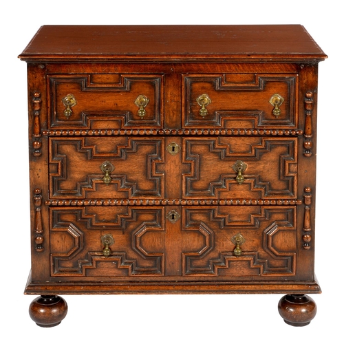 638 - A WILLIAM AND MARY STYLE GEOMETRIC MOULDED OAK CHEST OF DRAWERS, 20TH C  with brass drop handles, on... 