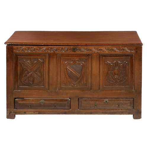 639 - A GEORGE III OAK MULE CHEST, WALES, 18TH C with boarded lid and later carved front, raised and field... 