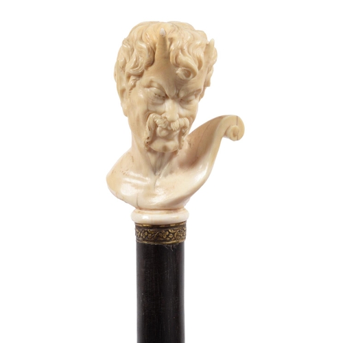 72 - AN EBONY WALKING CANE, PROBABLY FRENCH, LATE 19TH C the ivory handle carved as the head of a satyr, ... 