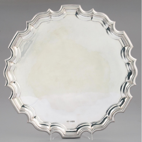 87 - A GEORGE V SILVER SALVER  on three leaf capped volute feet, 36.5cm diam, by Lee & Wigful Ltd, Sh... 