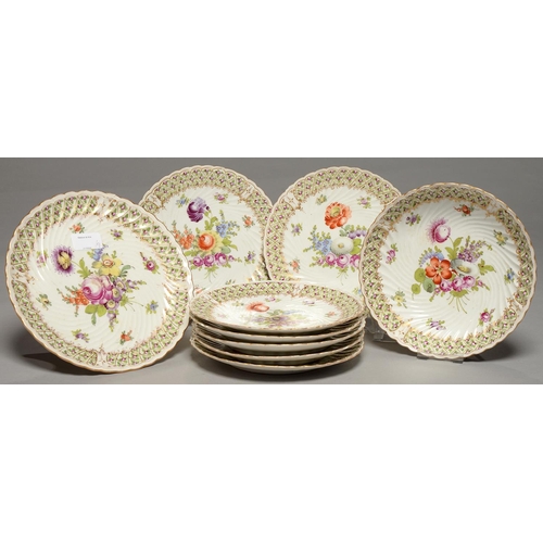 226 - A GERMAN SPIRALLY FLUTED PORCELAIN DESSERT SERVICE, EARLY 20TH C, FREELY PAINTED WITH LOOSE BOUQUETS... 